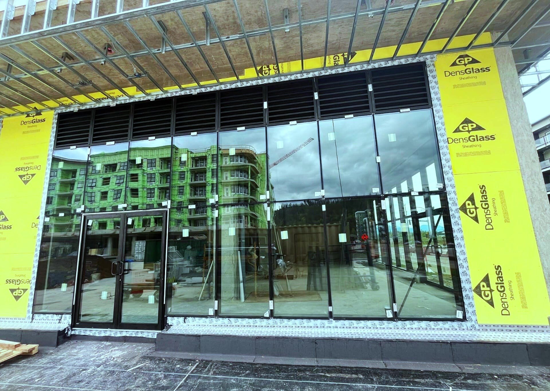 Commercial curtain-wall glazing installation in progress