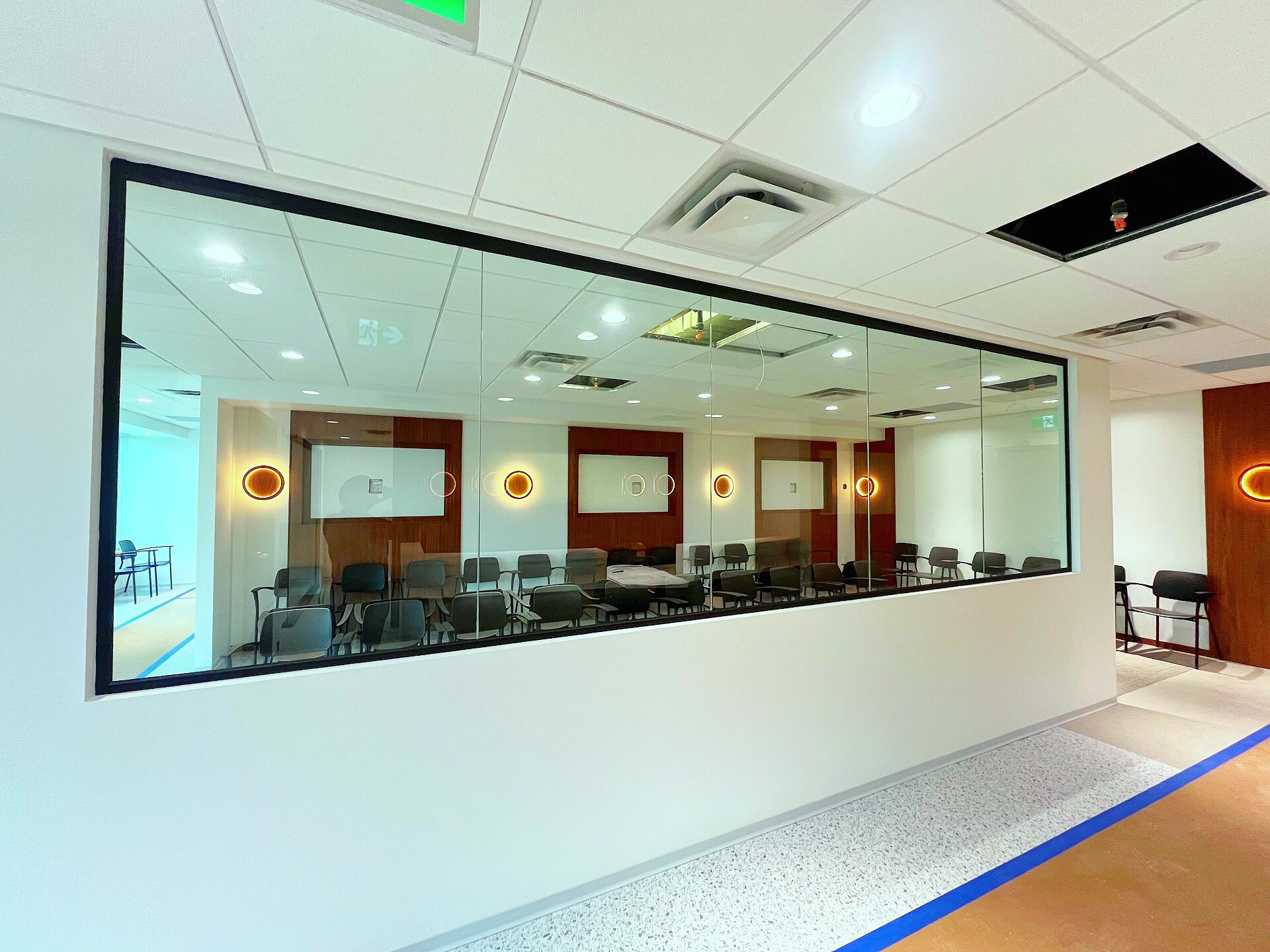 Large interior glass installation in a completed commercial space