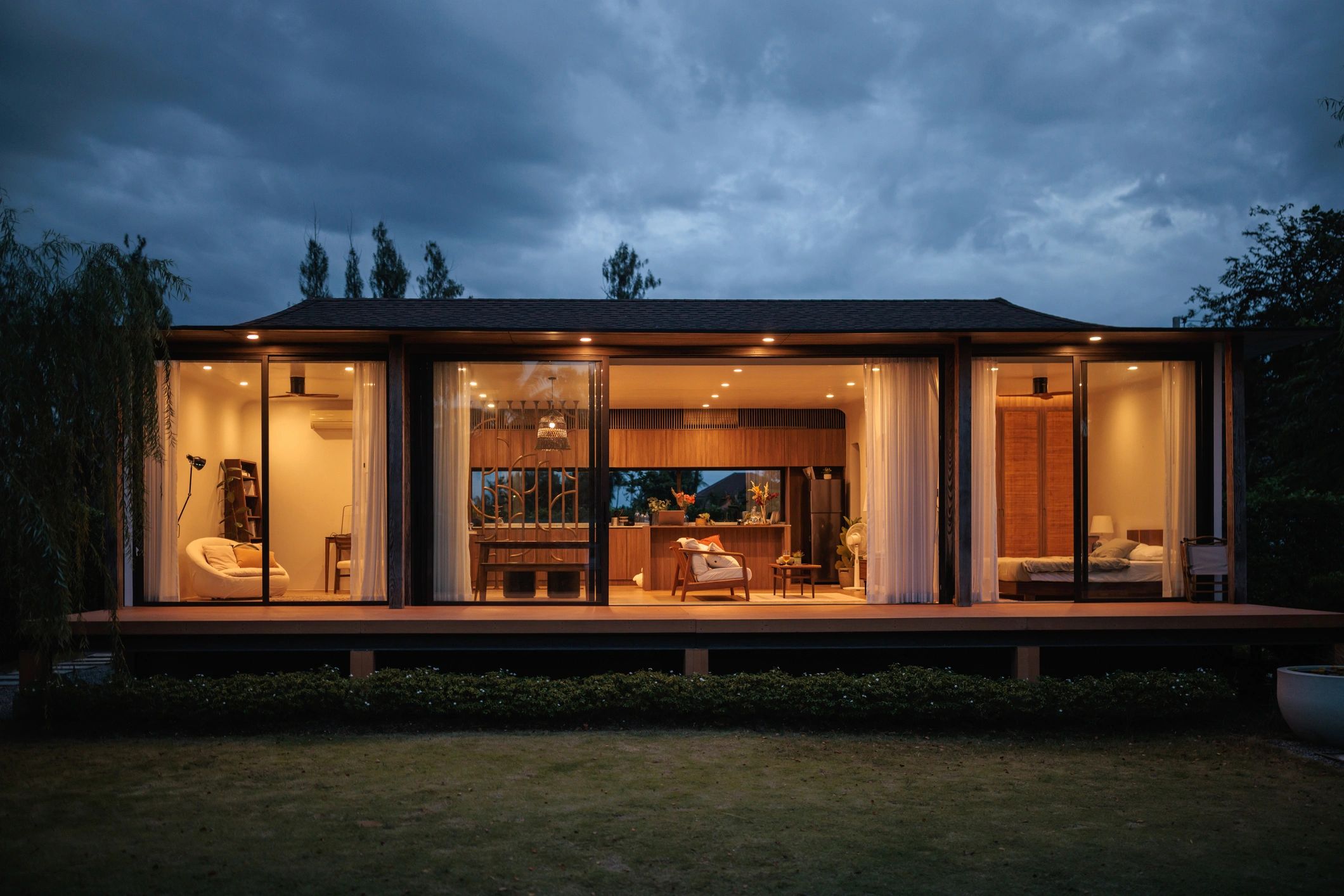 Modern home exterior with extensive glass features